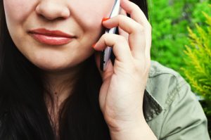 a woman call the moving company 