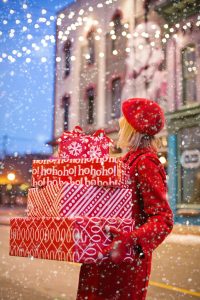 A woman carrying gifts - Moving out of state during holidays