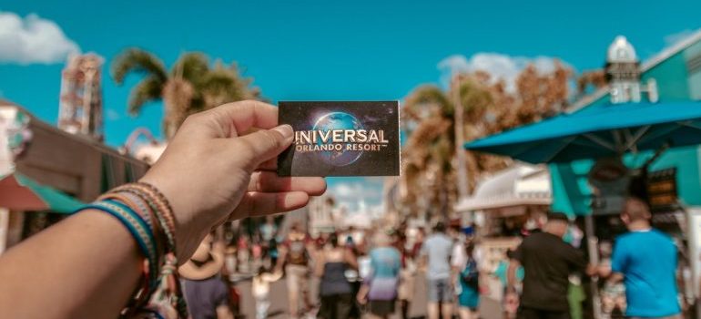 A person holding a ticket for Universal Studio located in one of the Best Central Florida Places for families 