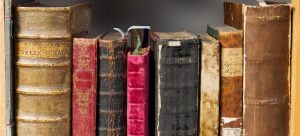 Pile of books you need to prepare before reading a guide about storing books