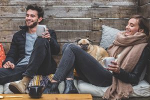 a happy couple with a dog