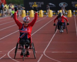 a man in wheelchair racing