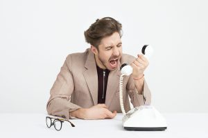 man screaming in the phone