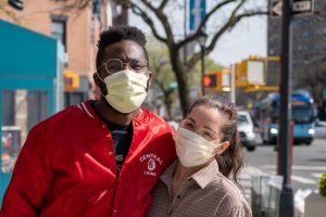 two people wearing masks