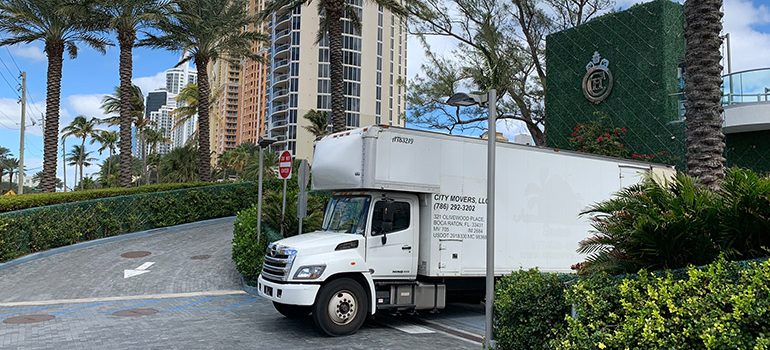 A truck about to transfer items to a storage facility.