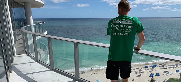 A mover looking at a beach as a symbol of movers Parkland FL