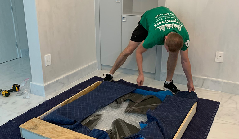 One of the Coral Springs movers handling a difficult item.