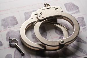 Handcuffs and a key on the table