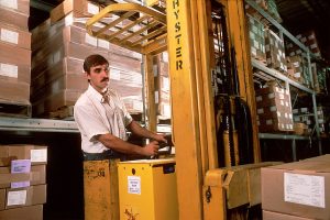 A worker inside a storage