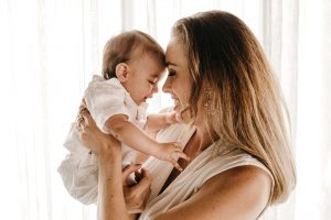 mother holding a baby