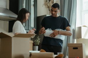 couple packing items for a move