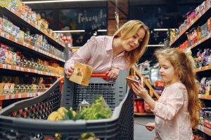 mom and daughter shopping for groceries