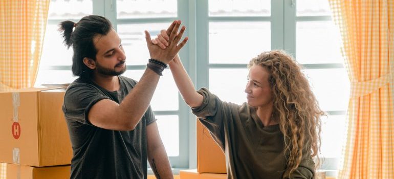 Two people giving high fives