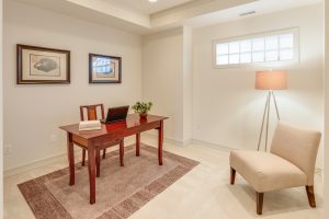 room with office table and a chair 