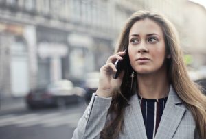 Business woman calling her office supplier