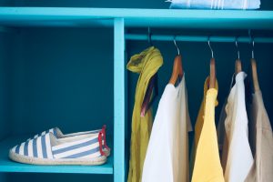 clothes hanging in the closet