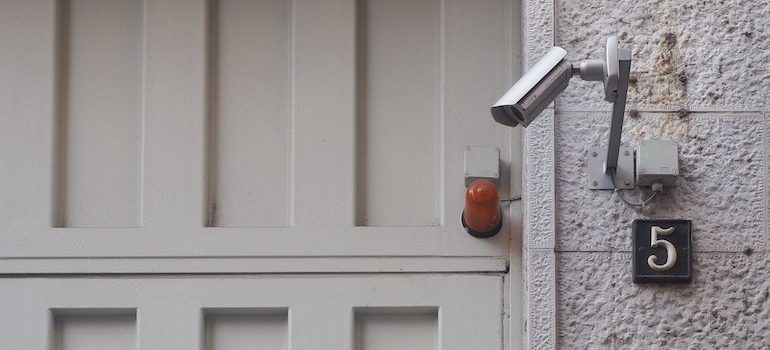 a security camera next to the door