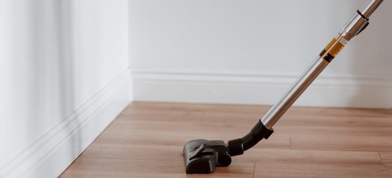 a vacuum cleaning the floor 