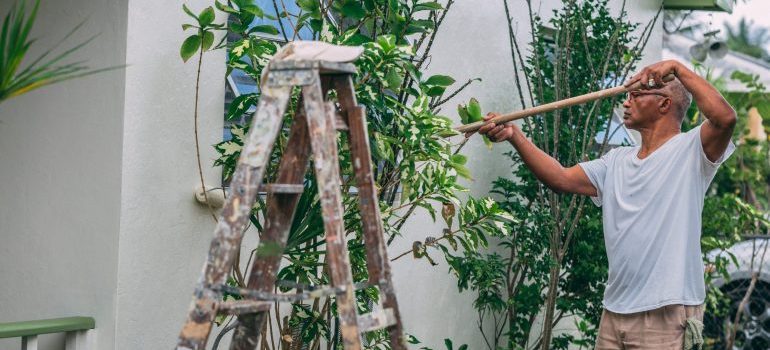 Man painting a house