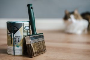 paint can with a brush - an example of what will professional movers not move