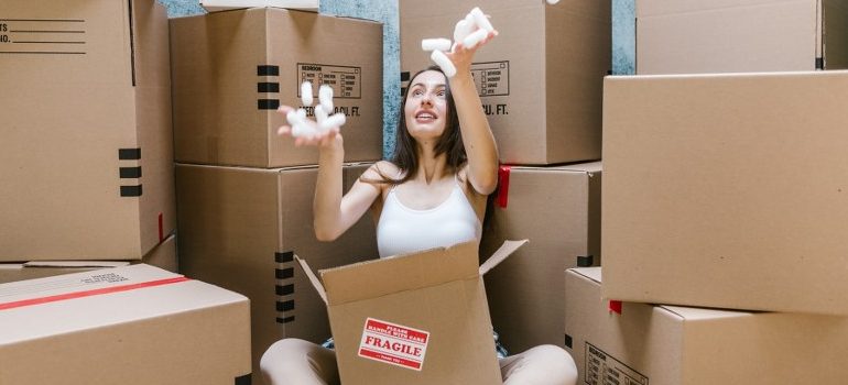 woman playing with packing peanuts