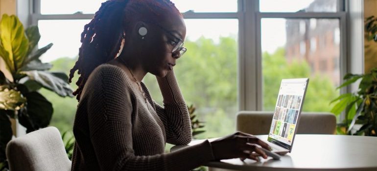 A woman doing a research on a laptop 