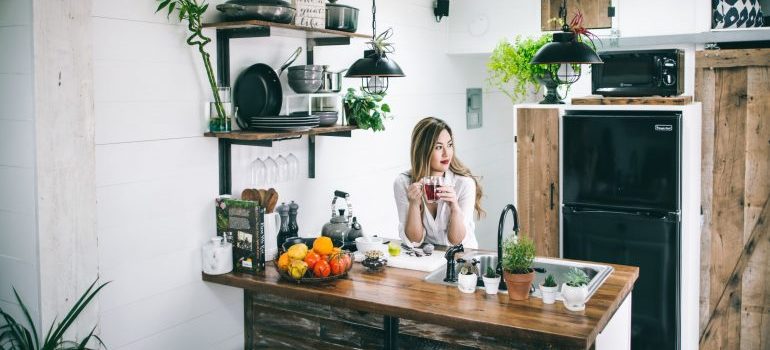A woman at a kitchen counter