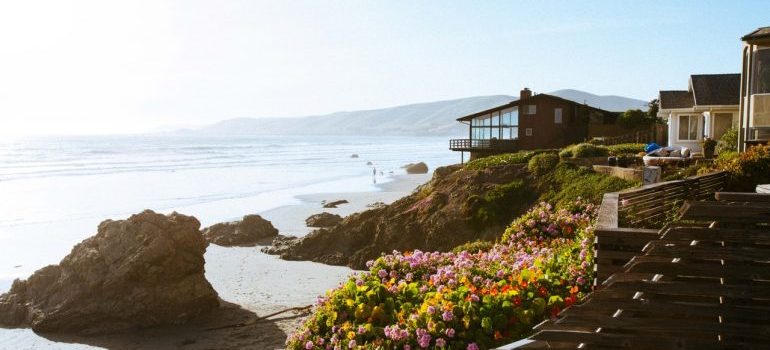 A view onto the beach from a beach house on a sunny day