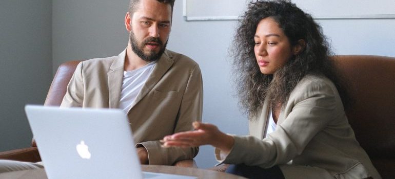 A man and a woman with a laptop