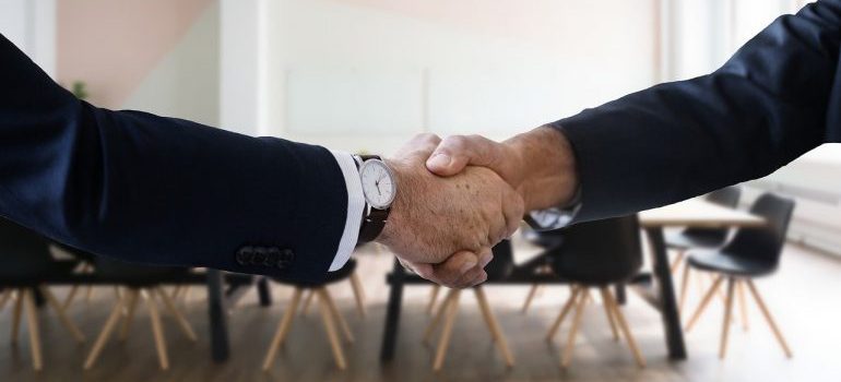 A handshake between two people.