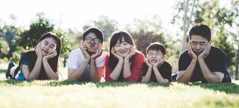 Happy family laying in the grass