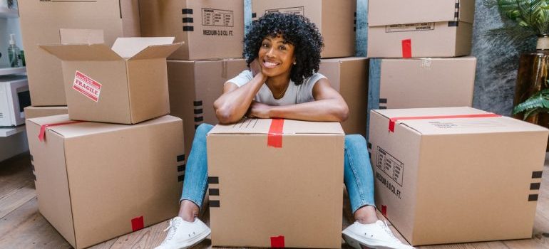 woman waiting for local movers Hallandale Beach