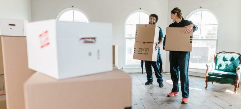 two men moving boxes