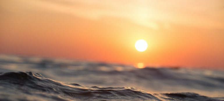 Sunset over the waves of the ocean