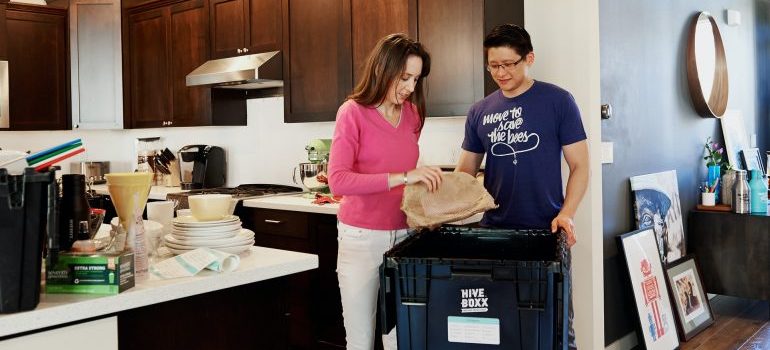 A family packing for their move from Delray Beach to Hialeah