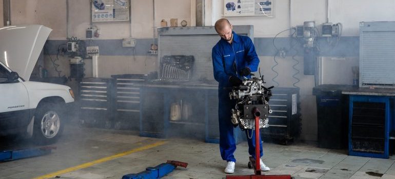 person fixing the car