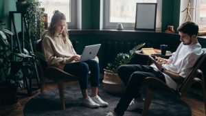 a couple sitting and reading