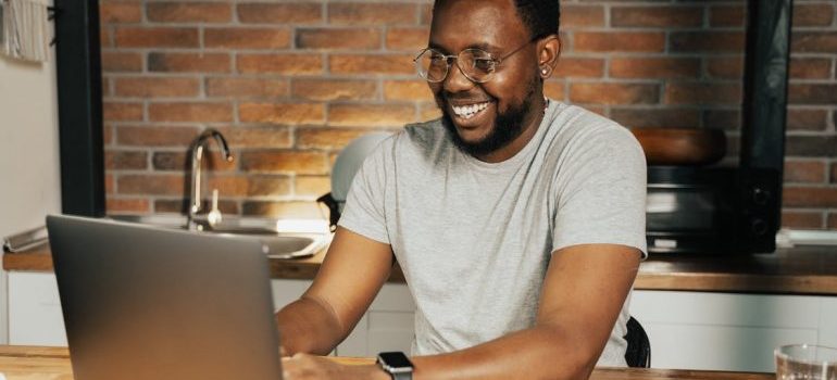 A man is using his laptop