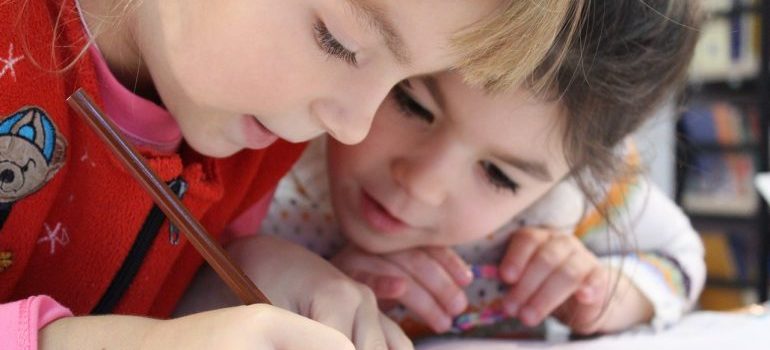 Kids writing in a notebook