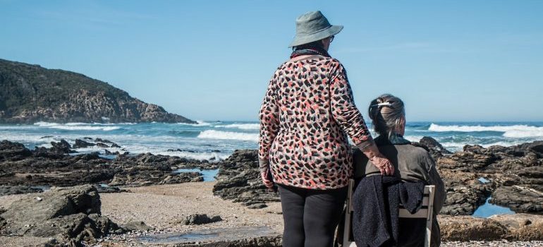 Two seniors on the beach.