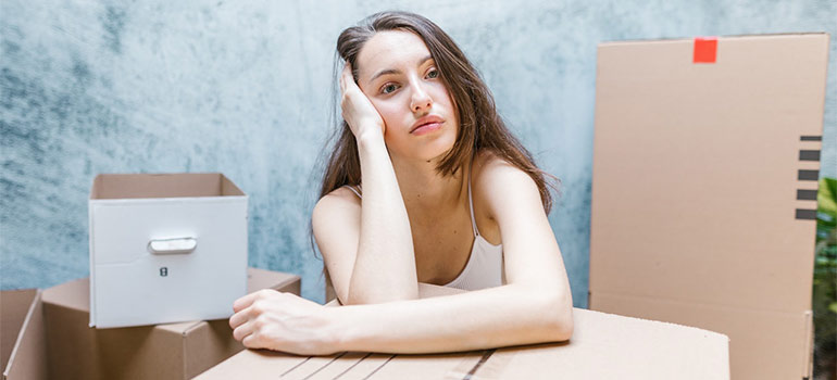 a woman thinking about safety leaned on the box