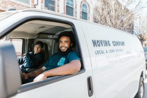 movers in a moving company van