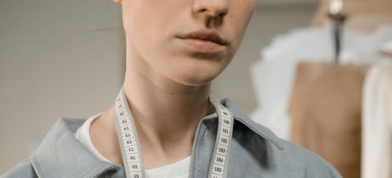 Woman holding measuring tape