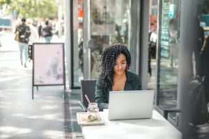 A woman looking at her laptop