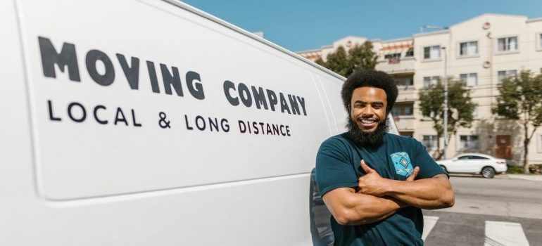 A mover in front of his van