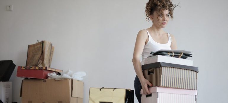 a woman taking boxes