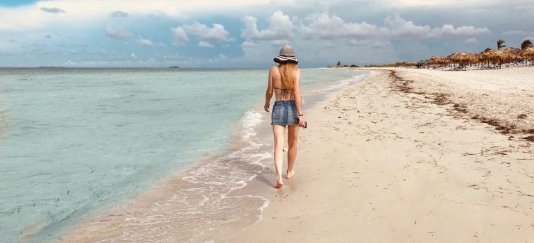 When leaving Miami for work, you will for sure miss walking on the beach like this woman