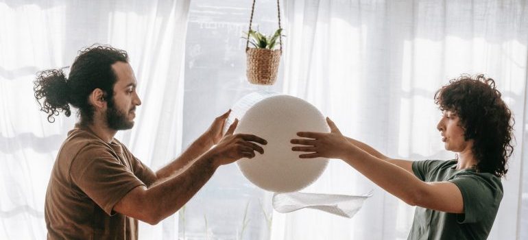 a couple holding bubble wrap