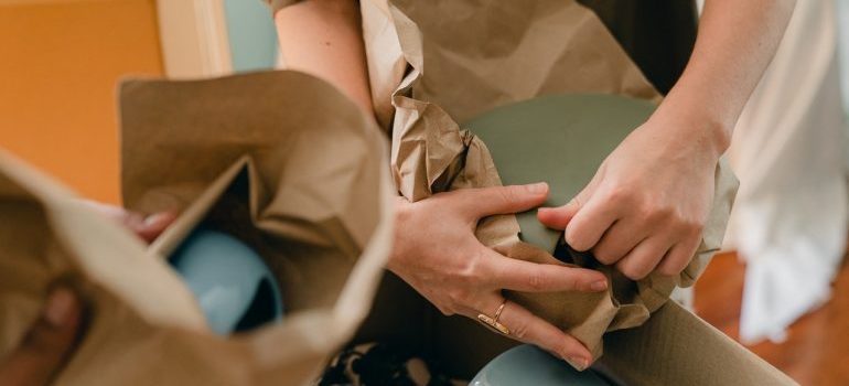 Person packing and wrapping things.