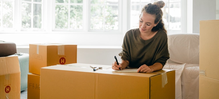 a woman planning to move a bar long-distance